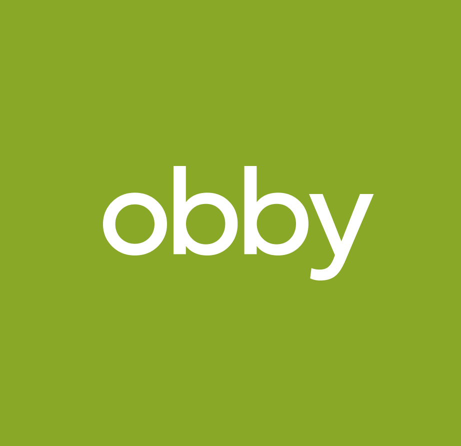 Photo of a man in a room using a tablet computer